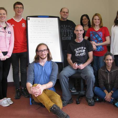 Irish language learners with teacher Andrew in an Oideas Gael classroom